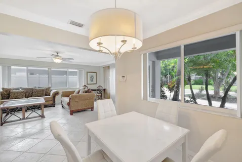 a kitchen with granite countertop a sink and a stove top oven