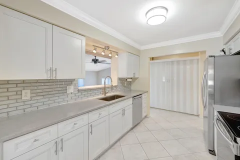 a kitchen with a stove and a microwave