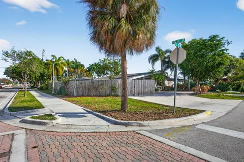 an aerial view of residential houses with city view