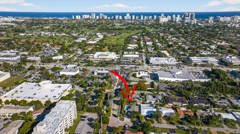 a couple of cars parked in front of a house