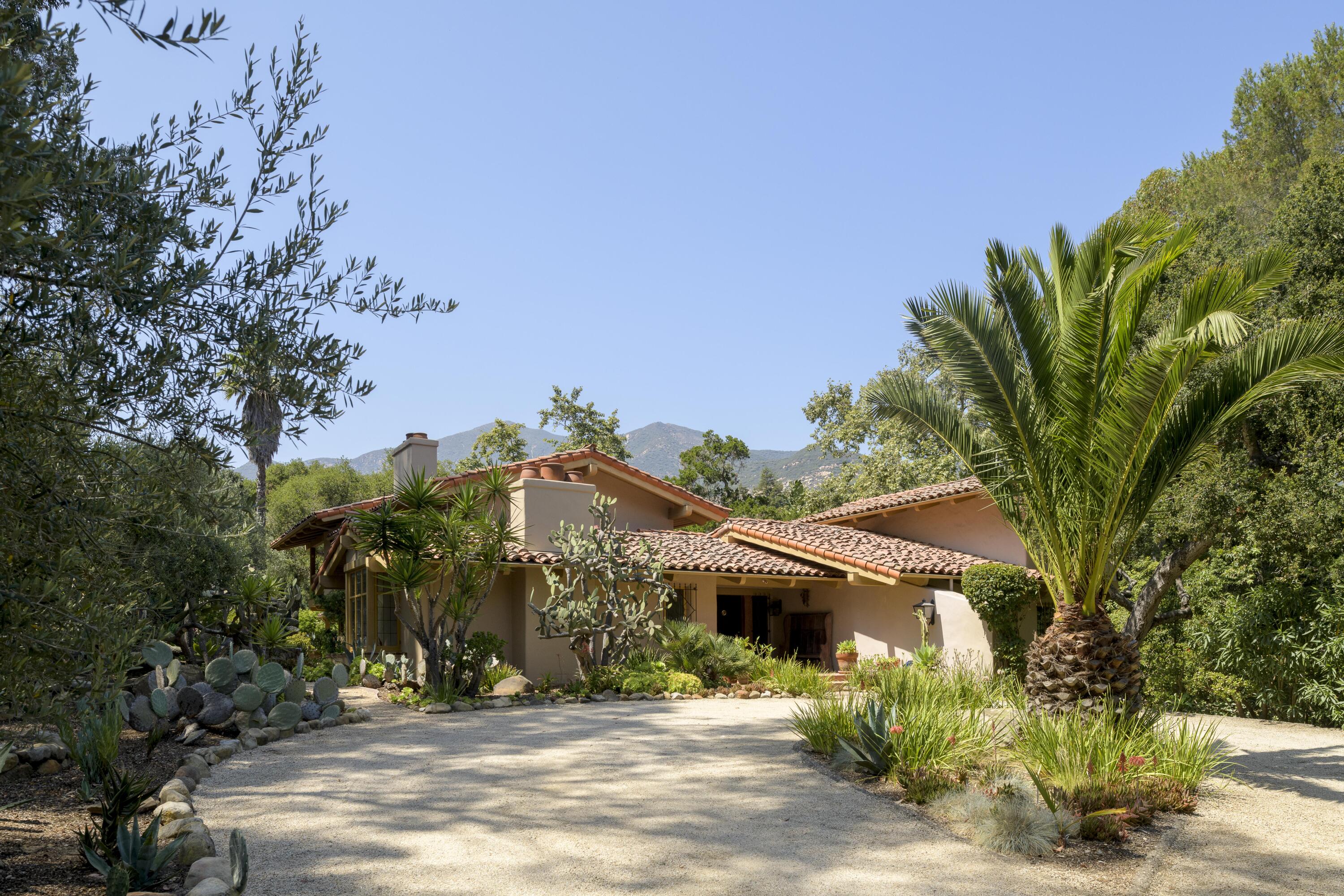 601 San Ysidro Road Santa Barbara, CA 93108 - Photo 1 of 1 a front view of a house with a tree