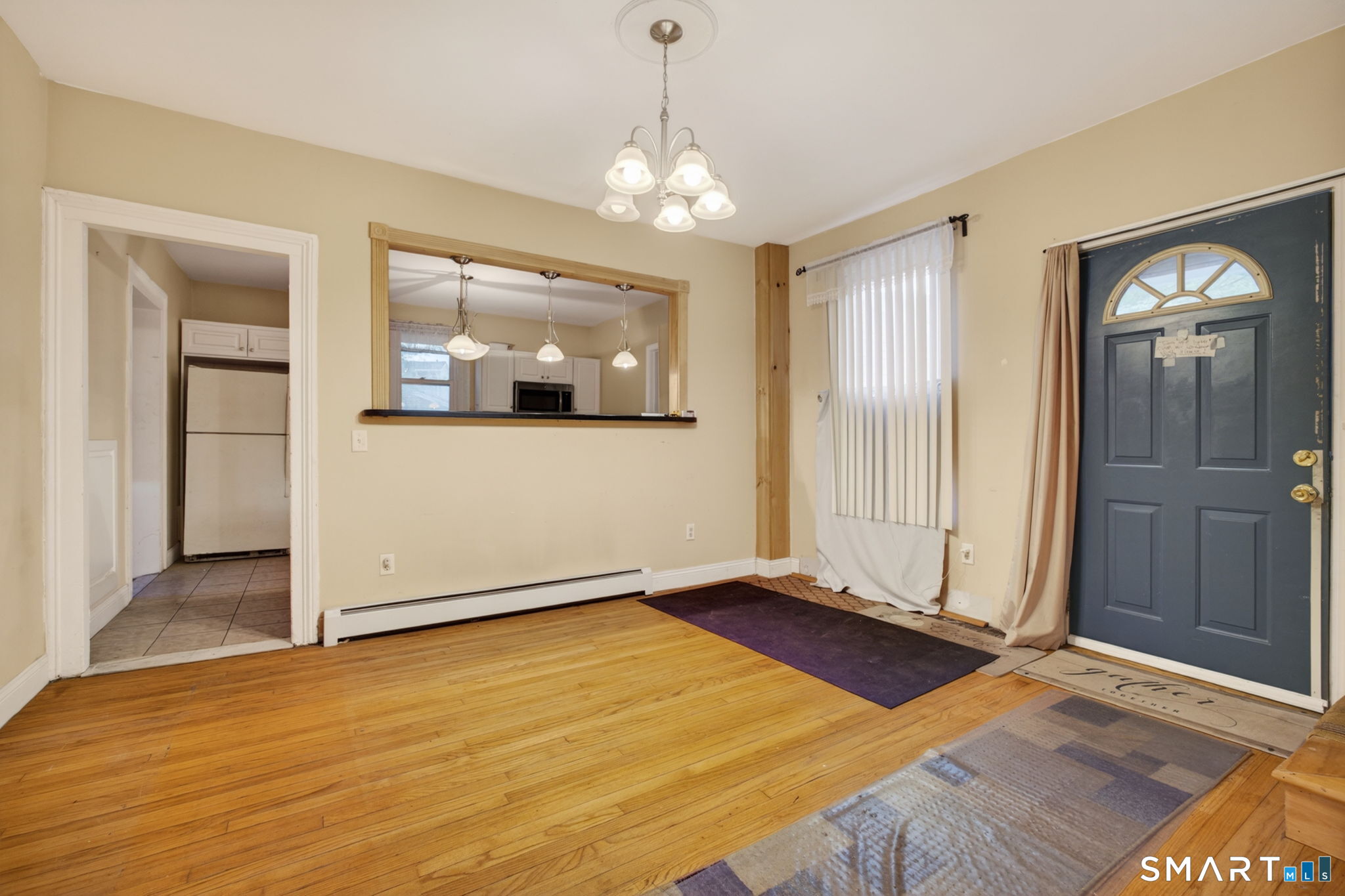670 Hanover Road Meriden, CT 06451 - Photo 18 of 40 a view of an empty room with window and wooden floor
