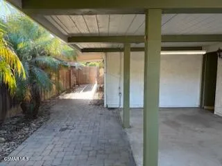 a view of a glass door with a trees in the background