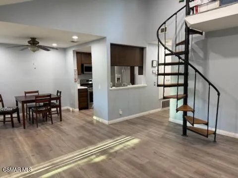a view of a livingroom with furniture and stairs