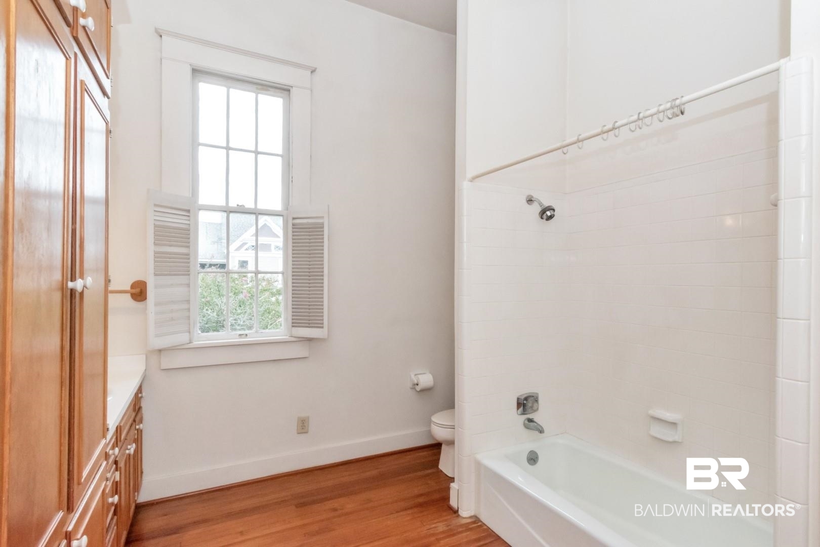 959 Dauphin Street Mobile, AL 36604 - Photo 27 of 43 Full bathroom featuring shower / washtub combination, vanity, wood-type flooring, and toilet