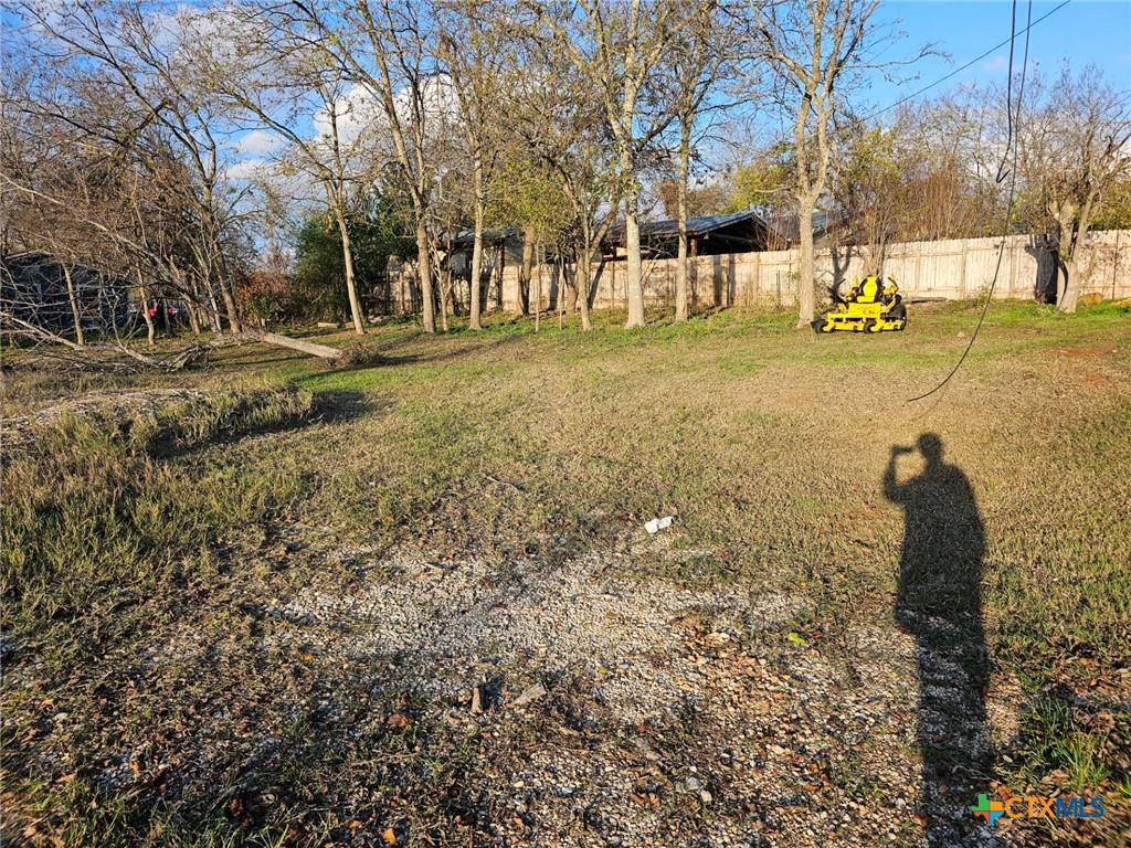 600 Alley A Street Elgin, TX 78621 - Photo 2 of 3 a backyard of apartments with large trees