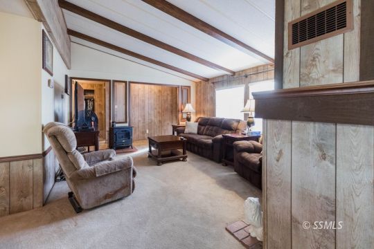 716 West Reeves Avenue Ridgecrest, CA 93555 - Photo 9 of 28 a living room with furniture and a large window
