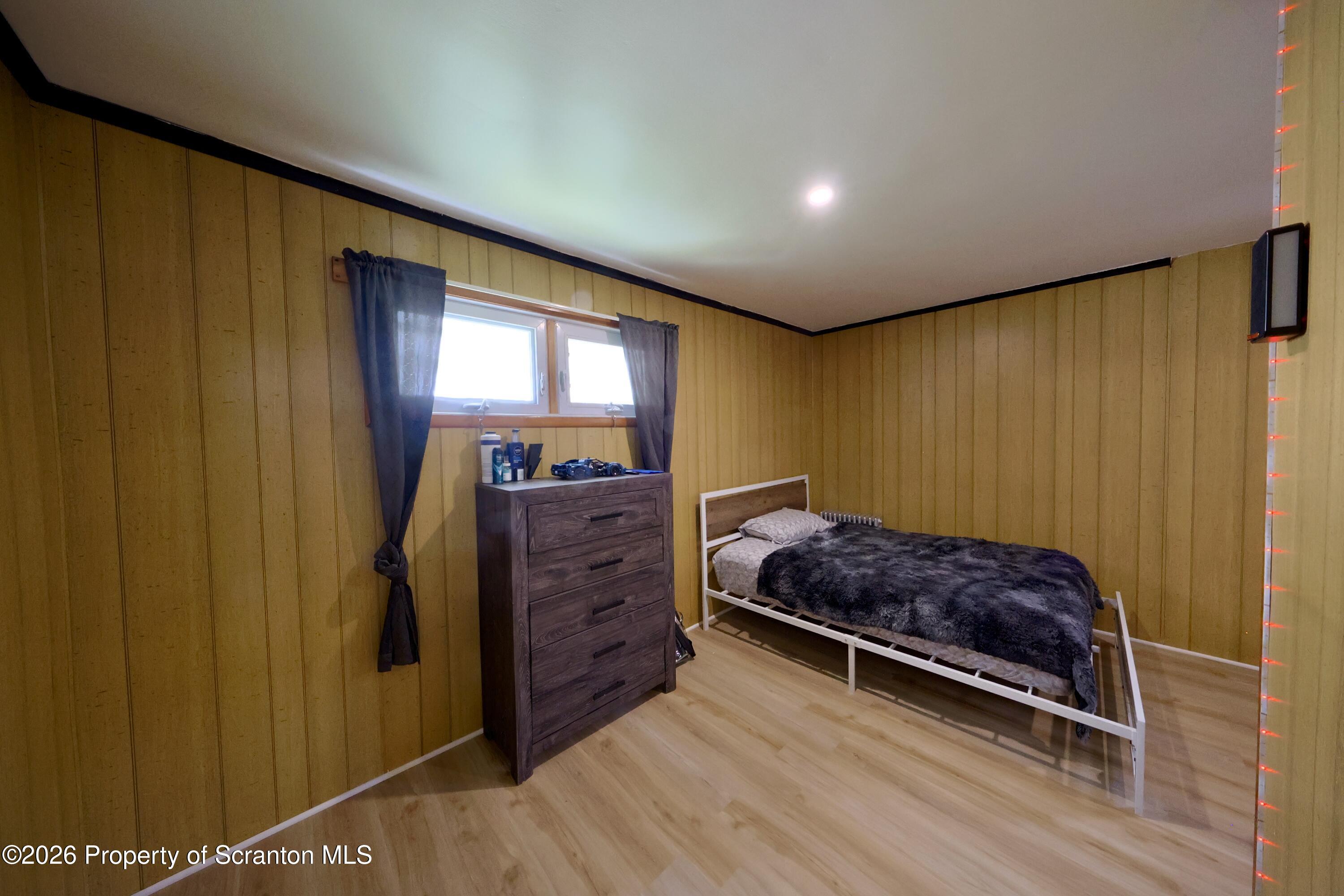 827 Main Street Sugar Notch, PA 18706 - Photo 21 of 25 a bed room with a bed and a mirror
