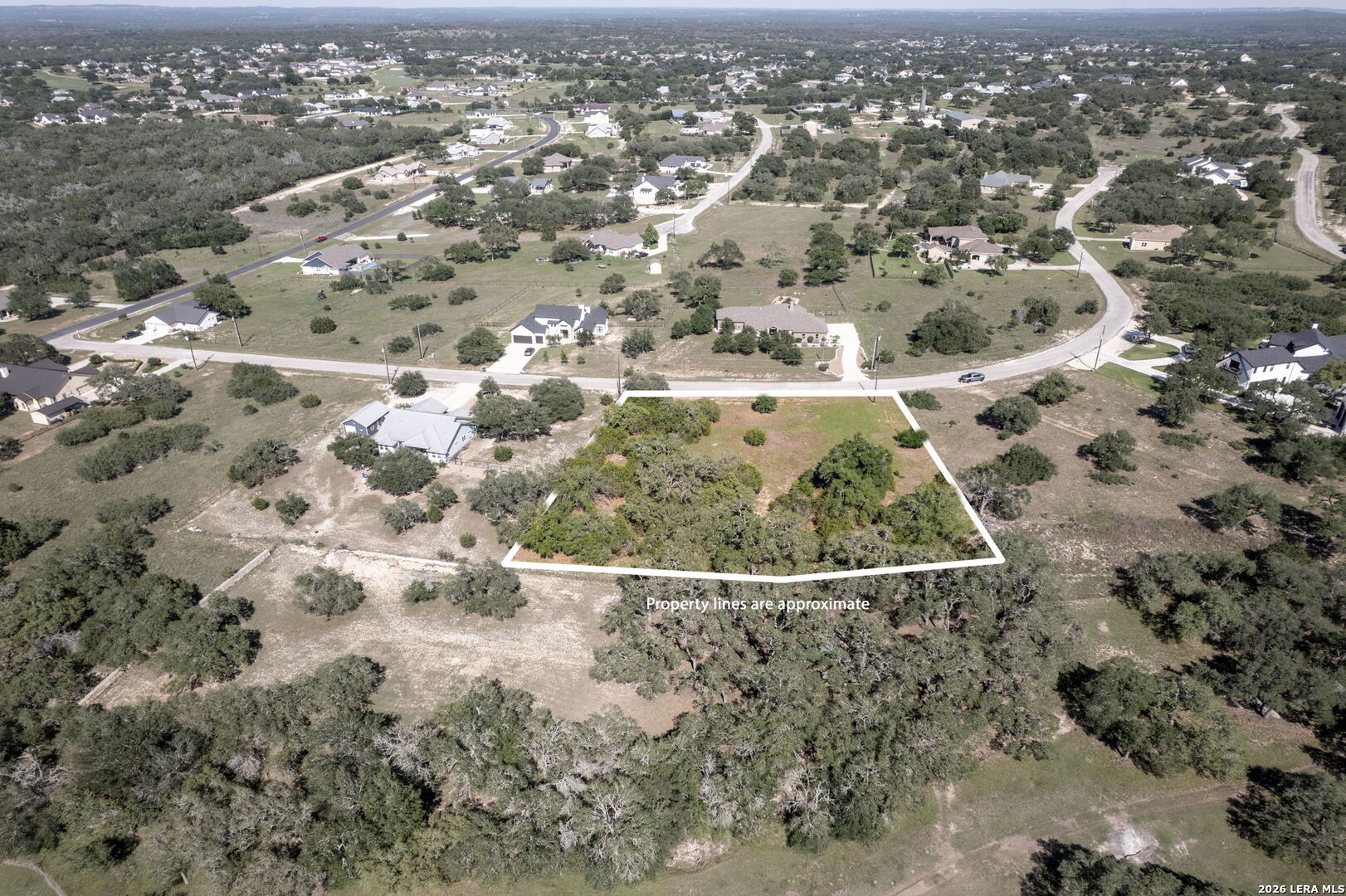 106 Riley Wood Blanco, TX 78606 - Photo 5 of 10 an aerial view of residential houses with outdoor space