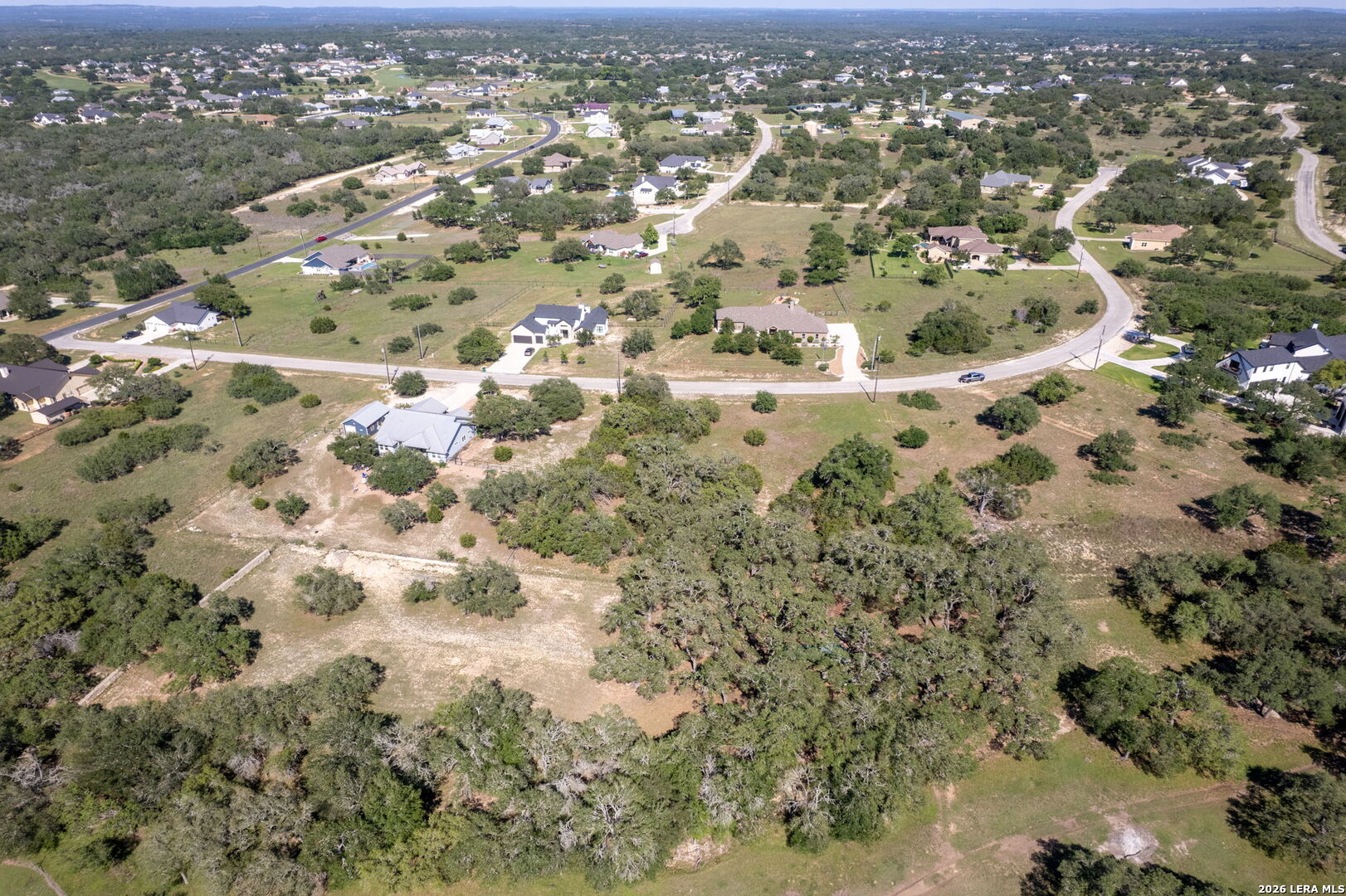 106 Riley Wood Blanco, TX 78606 - Photo 6 of 10 an aerial view of house with yard and mountain view in back