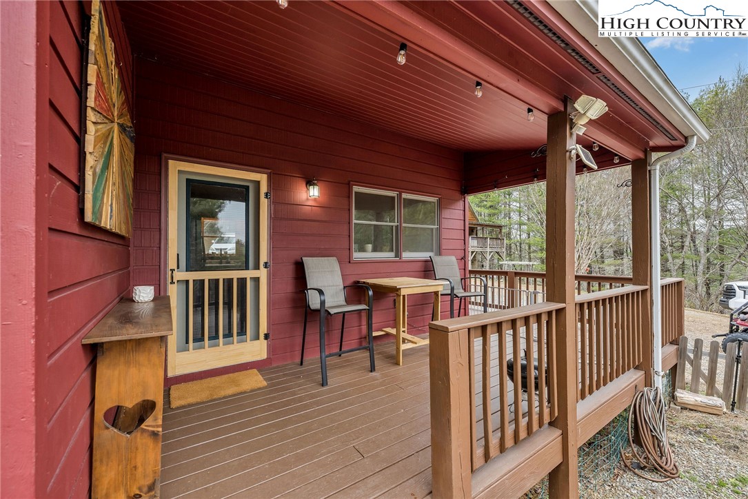 508 Curly Q Drive Crumpler, NC 28617 - Photo 8 of 39 a view of a patio with a table and chairs