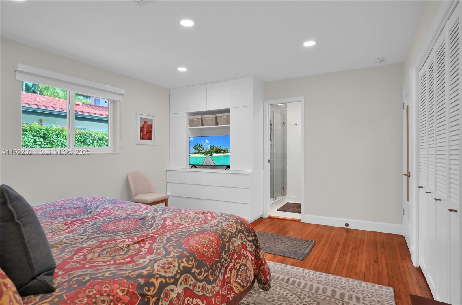 1409 Bird Road Coral Gables, FL 33146 - Photo 12 of 36 a bedroom with a bed and a window