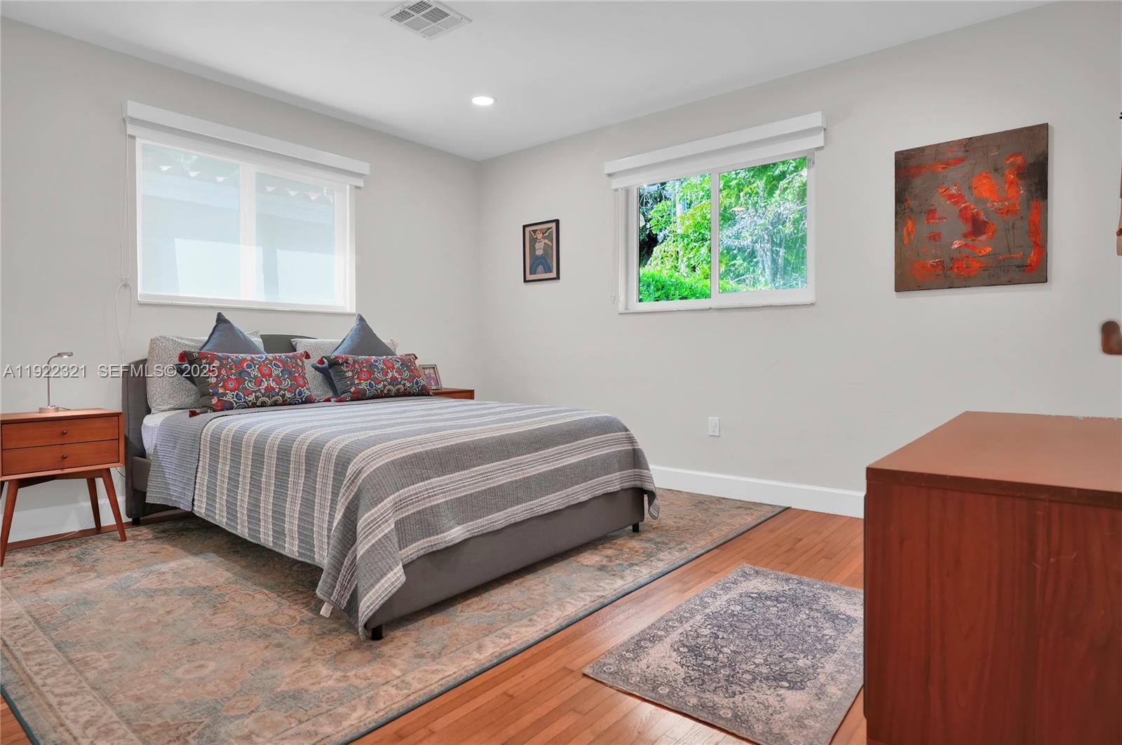 1409 Bird Road Coral Gables, FL 33146 - Photo 15 of 36 a bedroom with a bed and window