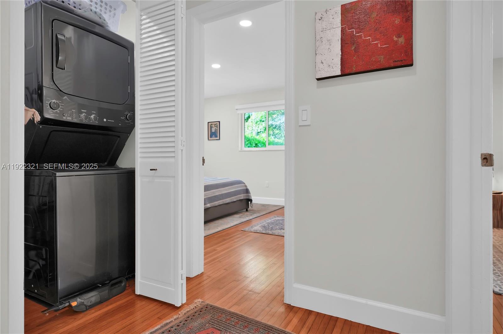 1409 Bird Road Coral Gables, FL 33146 - Photo 18 of 36 a living room with furniture and a flat screen tv