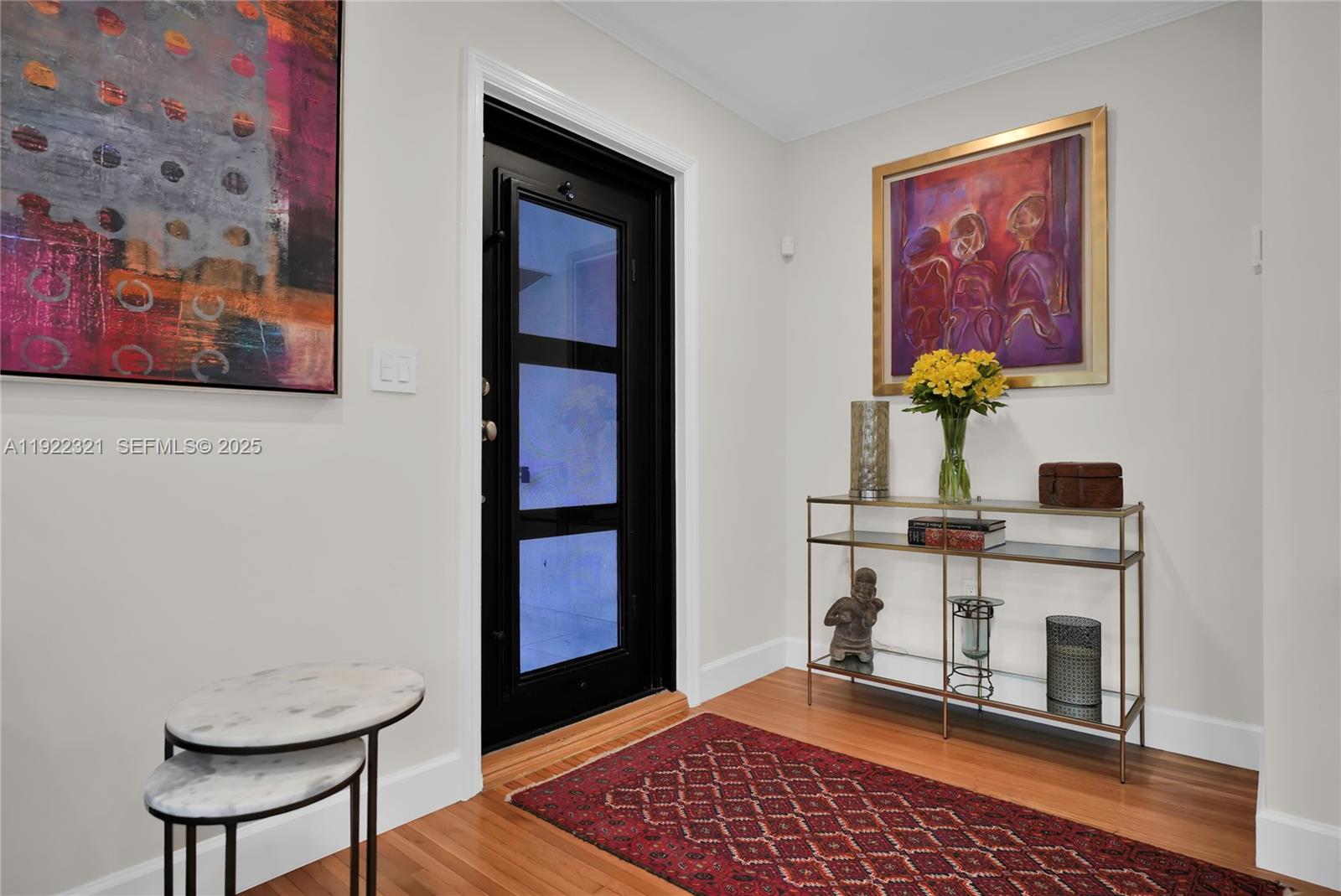 1409 Bird Road Coral Gables, FL 33146 - Photo 2 of 36 a view of a room with a table and a potted plant