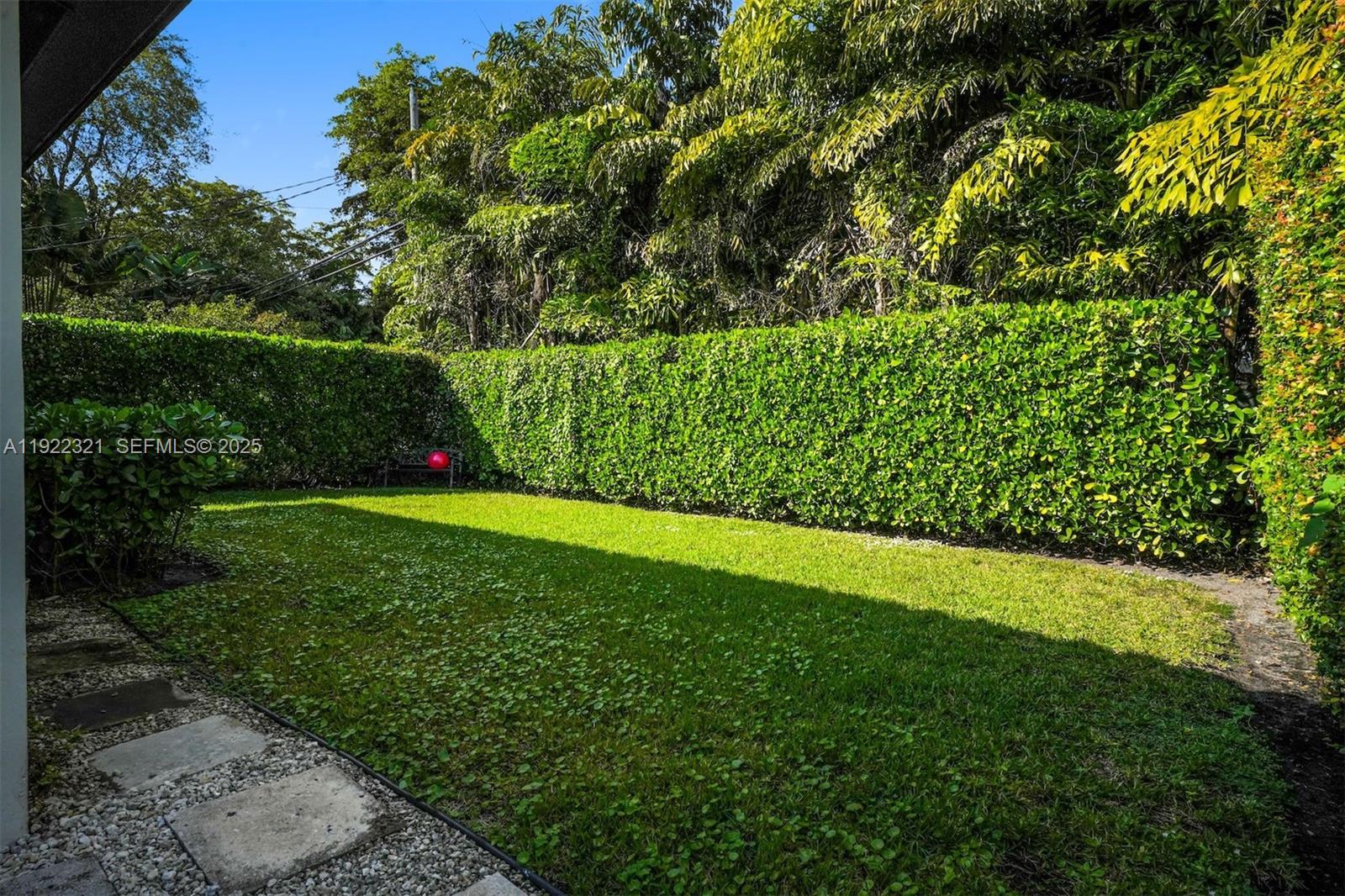 1409 Bird Road Coral Gables, FL 33146 - Photo 25 of 36 a view of a golf course with a garden