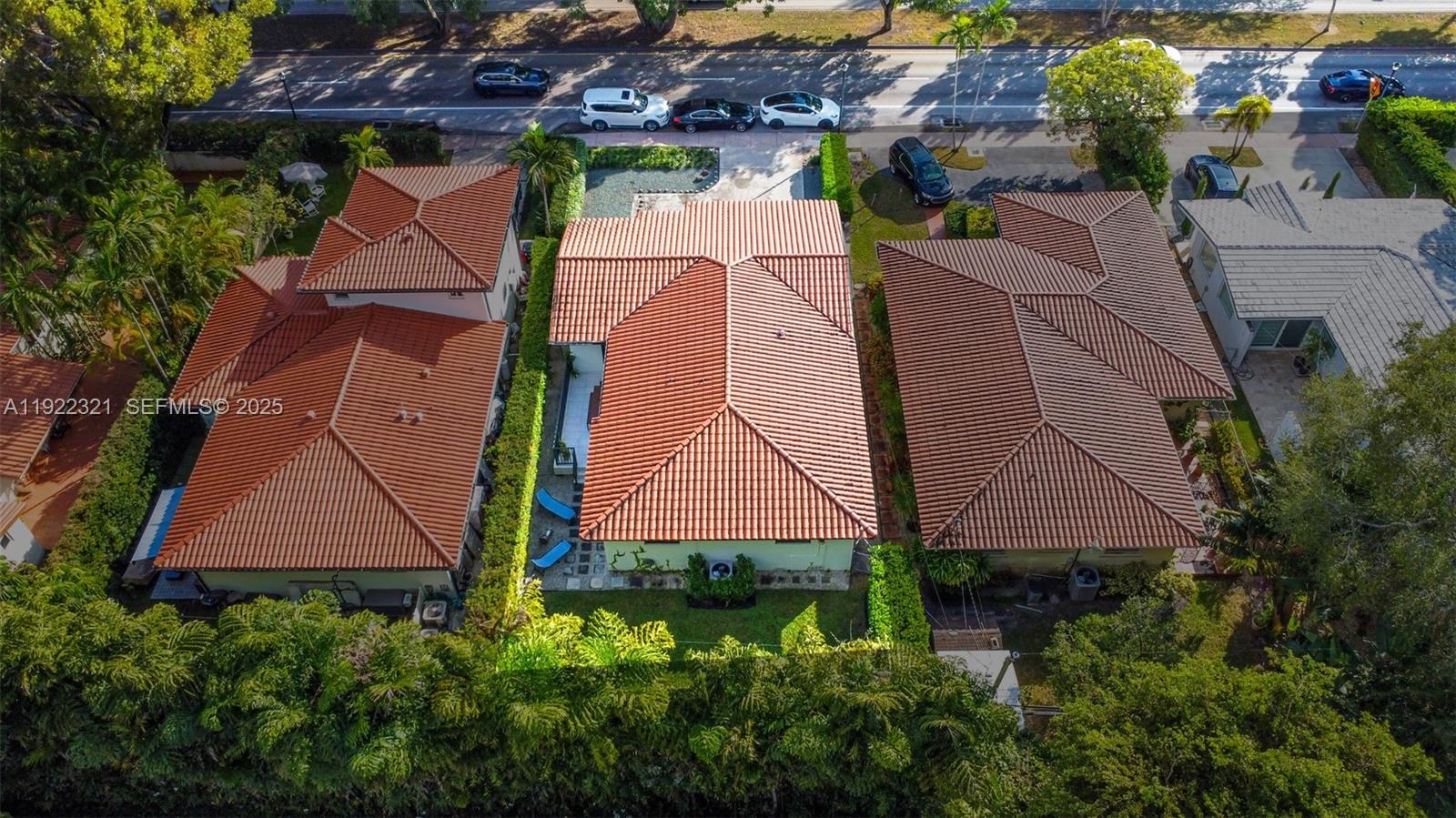 1409 Bird Road Coral Gables, FL 33146 - Photo 30 of 36 an aerial view of multiple houses with a yard