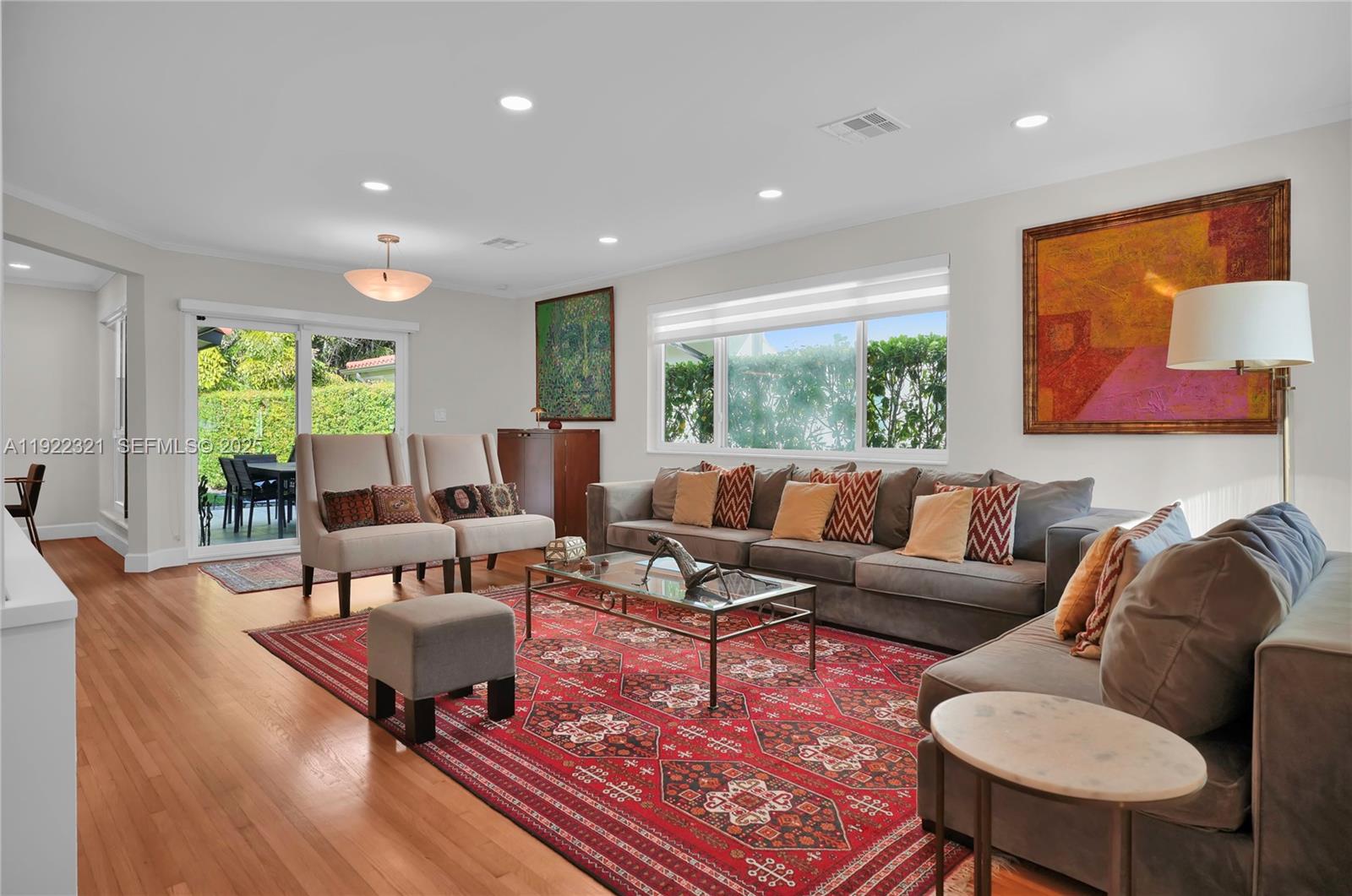 1409 Bird Road Coral Gables, FL 33146 - Photo 3 of 36 a living room with furniture and a rug