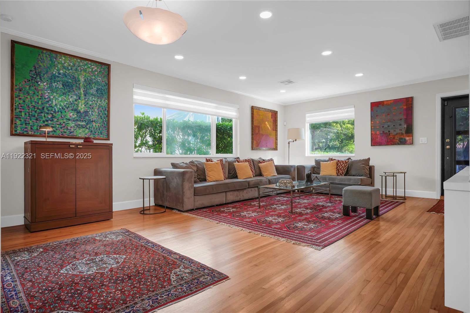 1409 Bird Road Coral Gables, FL 33146 - Photo 4 of 36 a living room with furniture rug and window