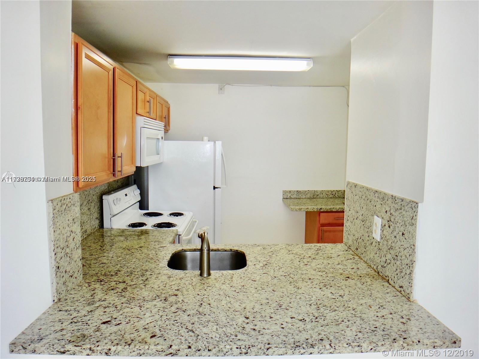 498 Northwest 165th Street, Unit D307 Miami, FL 33169 - Photo 6 of 24