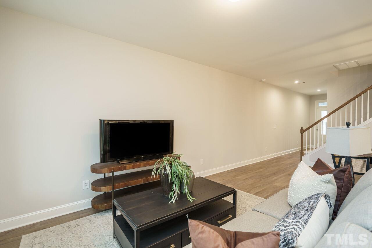 3111 Dunnock Drive, Unit 4 Durham, NC 27713 - Photo 5 of 26 a living room with furniture and a flat screen tv