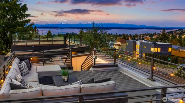 a view of a balcony with wooden floor and city view