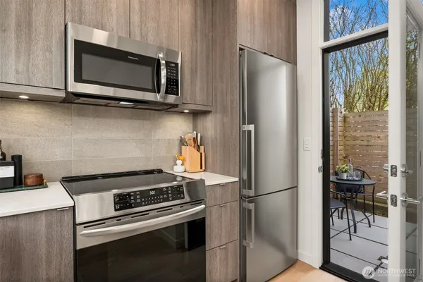 a kitchen with a stove and a microwave