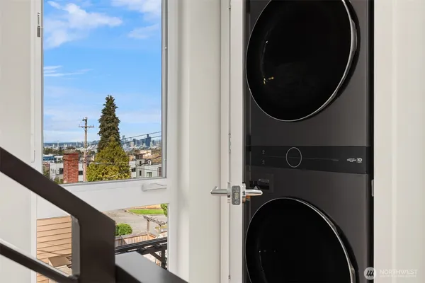 a view of a hallway with washer and dryer
