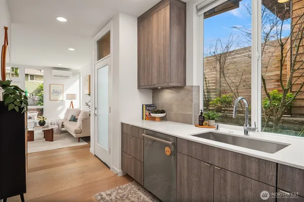 a kitchen with a sink and a large window
