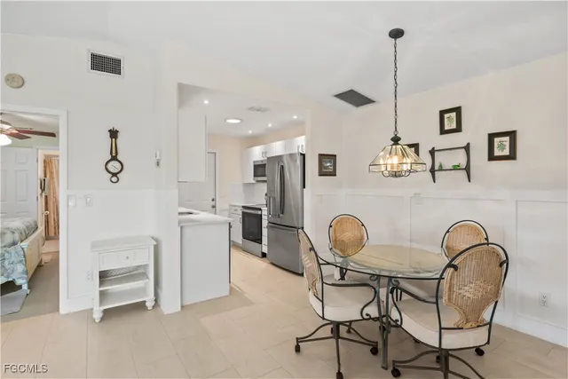 a kitchen with a sink stove and refrigerator