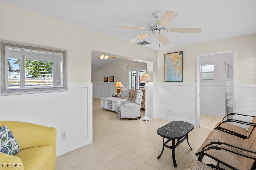 2781 Bruce Street Matlacha, FL 33993 - Photo 18 of 39 a living room with furniture and a chandelier