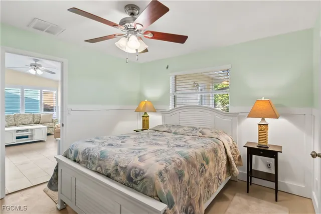 a bedroom with a bed and dresser