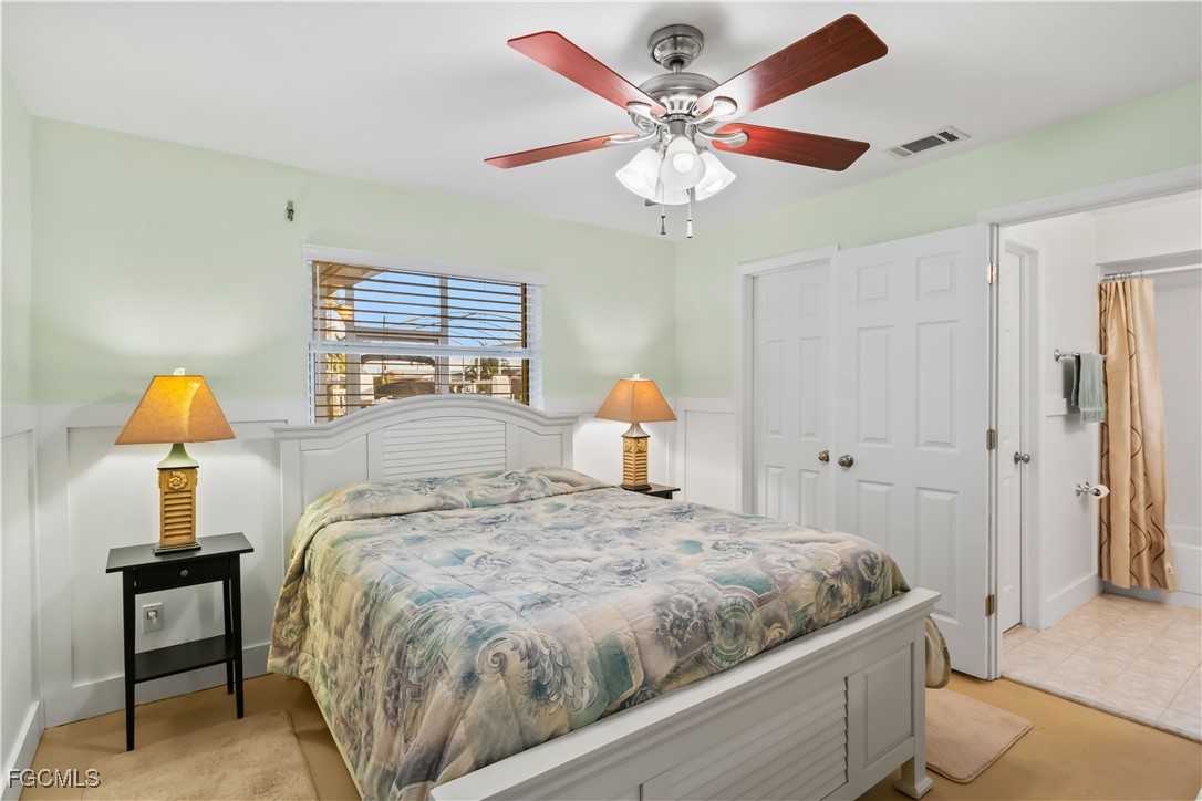 2781 Bruce Street Matlacha, FL 33993 - Photo 20 of 39 a bedroom with a bed and dresser