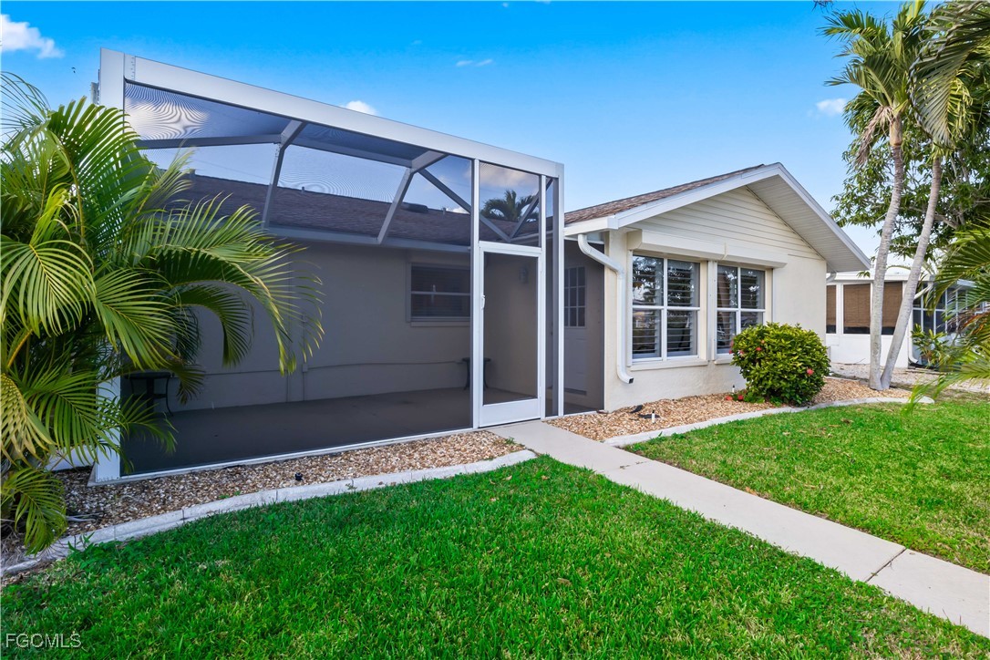 2781 Bruce Street Matlacha, FL 33993 - Photo 27 of 39 a view of backyard with a garden and plants
