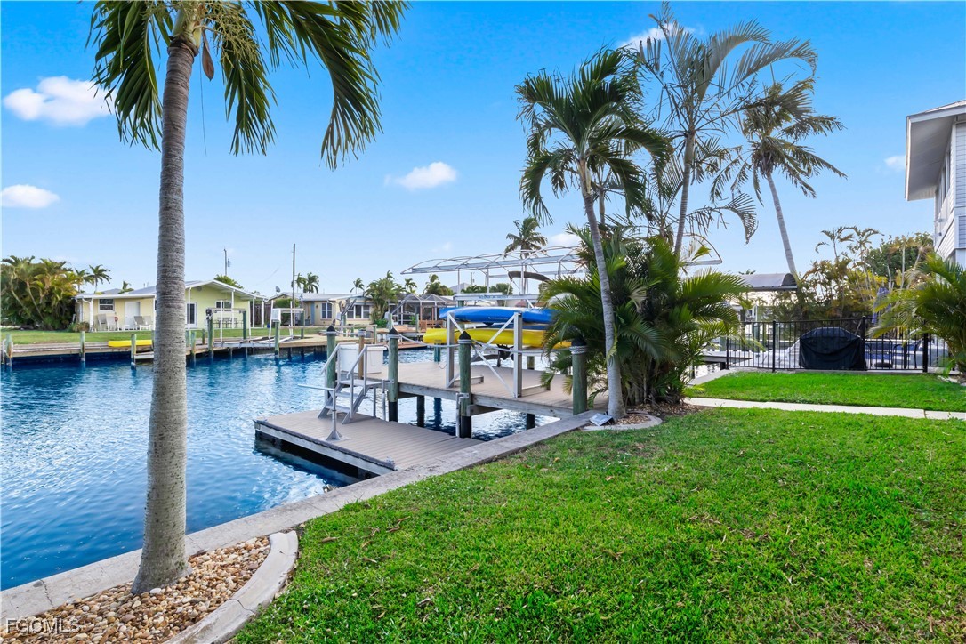 2781 Bruce Street Matlacha, FL 33993 - Photo 29 of 39 a view of a swimming pool with a table and chairs