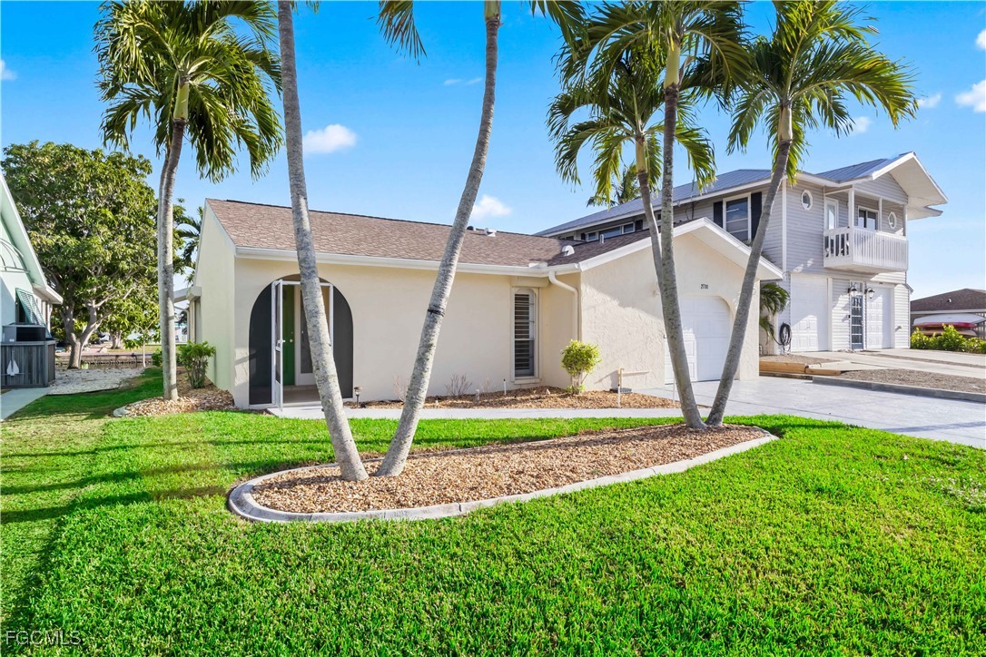 2781 Bruce Street Matlacha, FL 33993 - Photo 3 of 39 a view of outdoor space yard and swimming pool