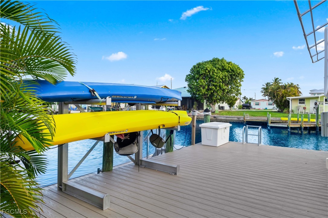 2781 Bruce Street Matlacha, FL 33993 - Photo 31 of 39 a view of a chairs and table on the wooden floor