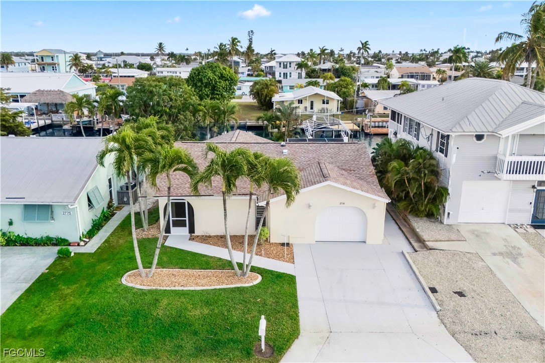 2781 Bruce Street Matlacha, FL 33993 - Photo 5 of 39 a aerial view of a house with a yard and trees
