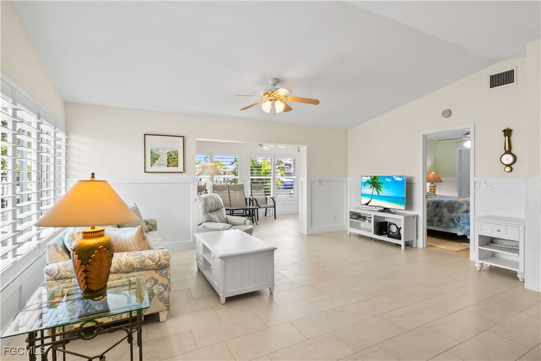2781 Bruce Street Matlacha, FL 33993 - Photo 7 of 39 a living room with furniture and a chandelier