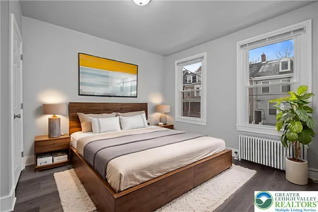 a view of a yard with wooden fence