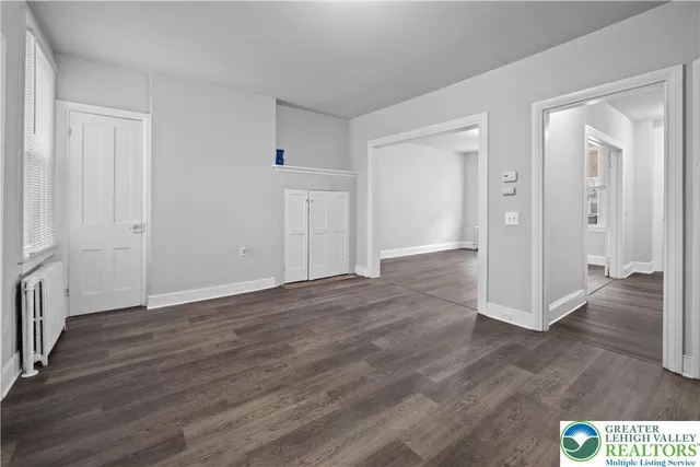 a kitchen with a refrigerator sink and cabinets