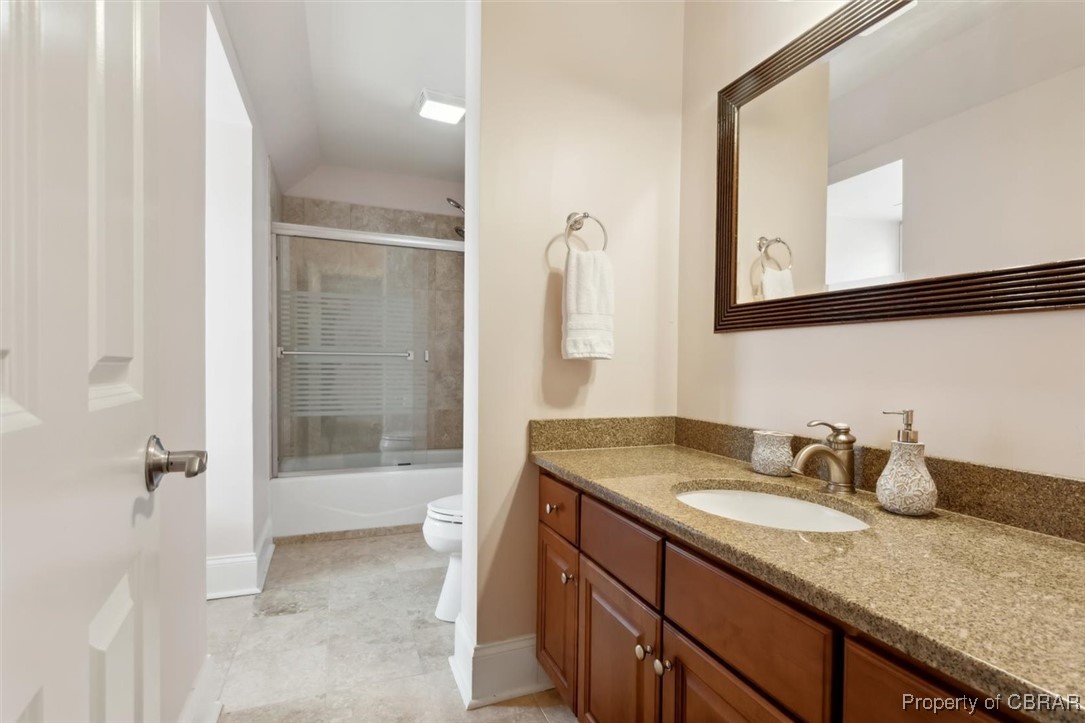 3013 Ridge Drive Toano, VA 23168 - Photo 25 of 50 Full bath featuring bath / shower combo with glass door, toilet, vaulted ceiling, baseboards, and vanity
