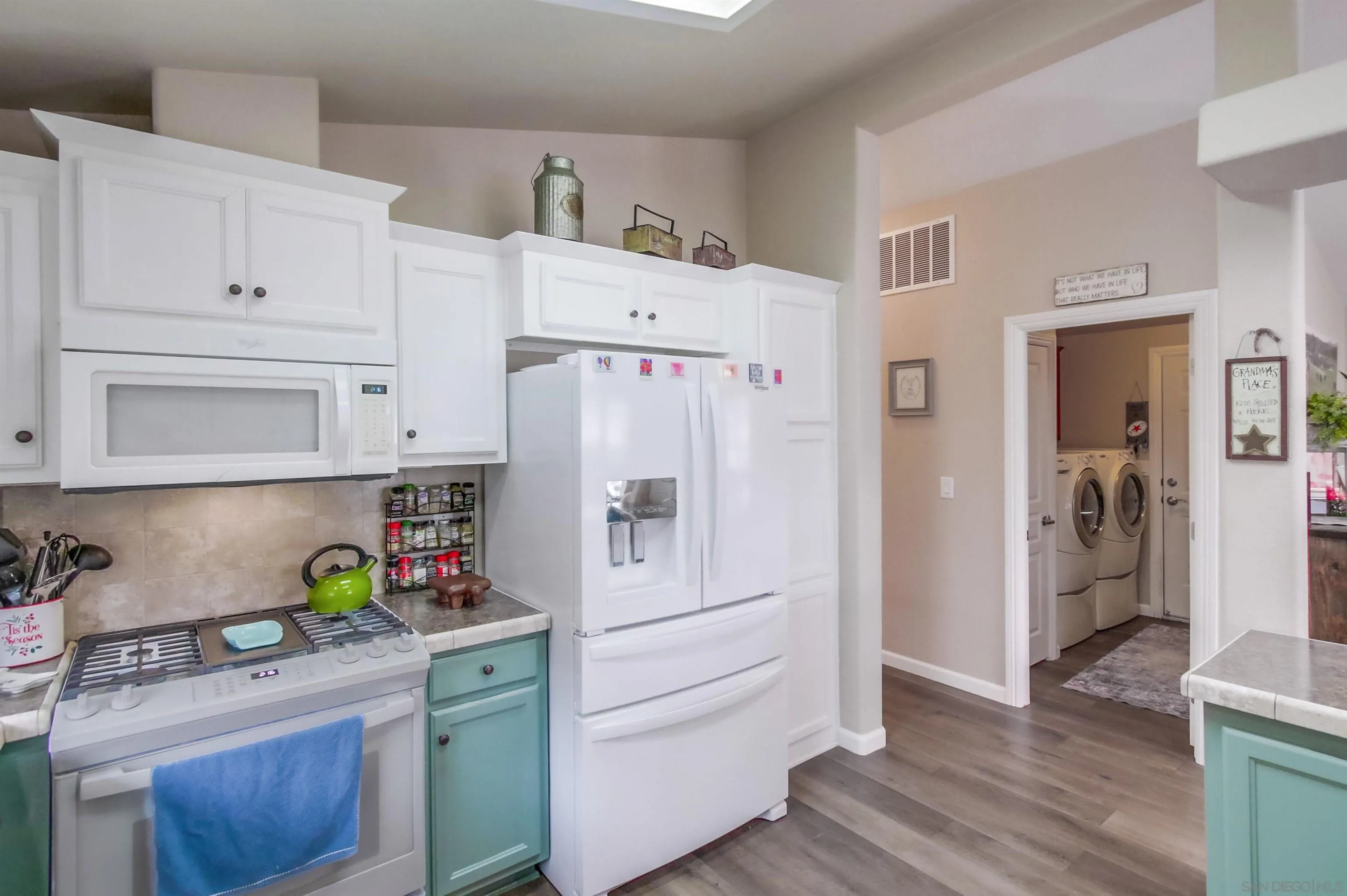 15935 Spring Oaks Road, Unit SPACE 16 El Cajon, CA 92021 - Photo 12 of 45 a kitchen with stainless steel appliances cabinets and a window