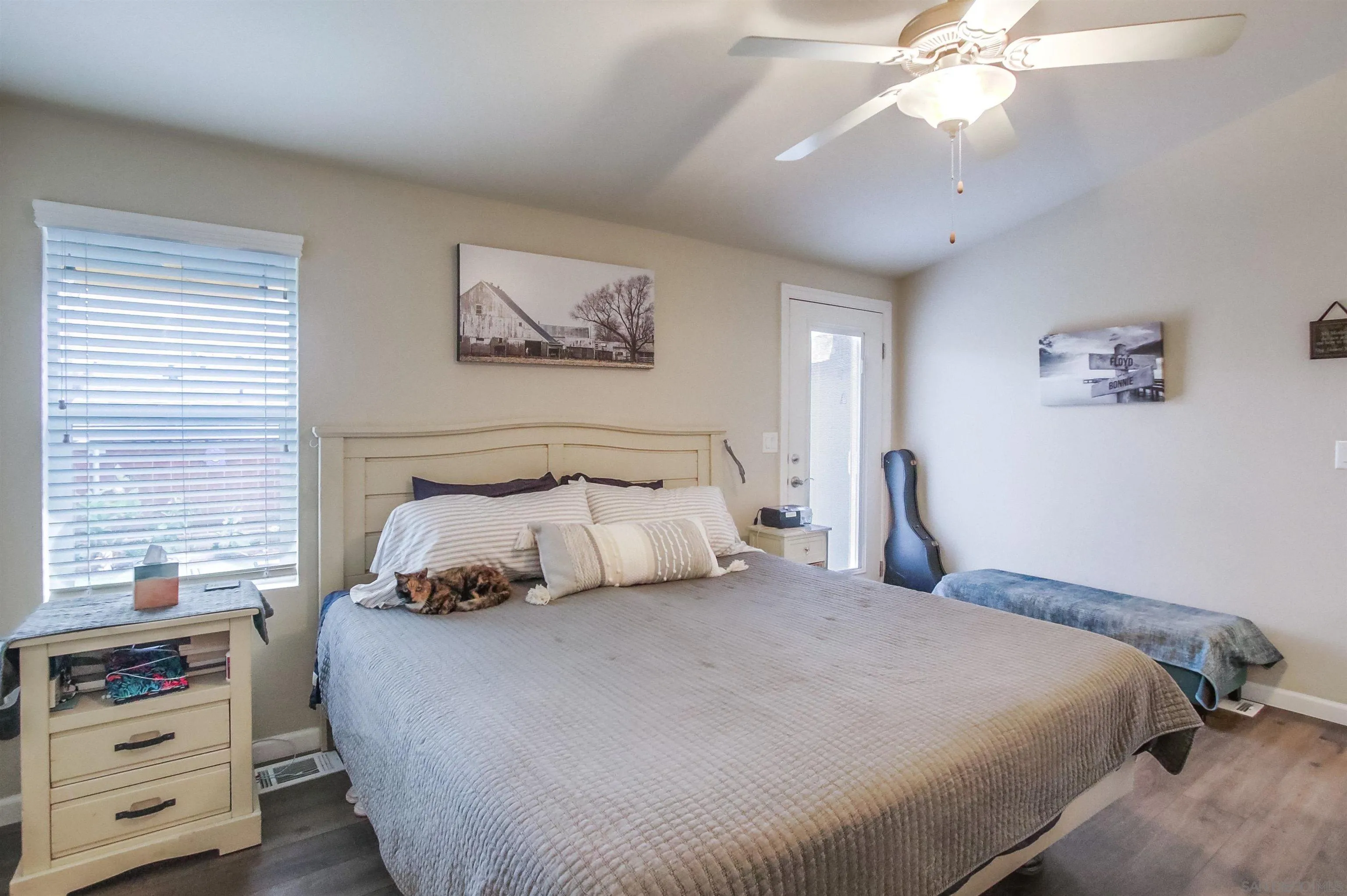 15935 Spring Oaks Road, Unit SPACE 16 El Cajon, CA 92021 - Photo 16 of 45 a bedroom with a bed and a chandelier