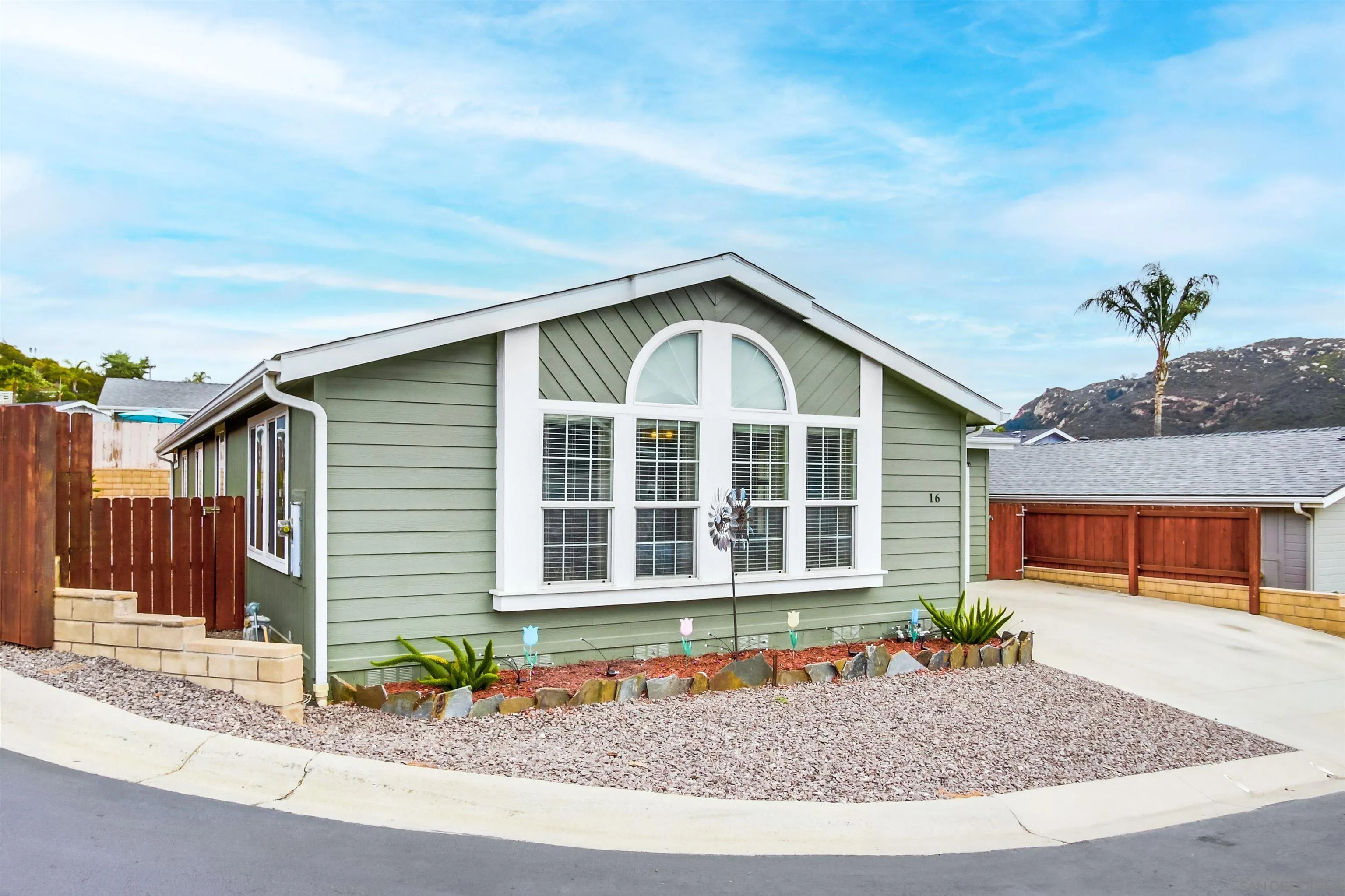 15935 Spring Oaks Road, Unit SPACE 16 El Cajon, CA 92021 - Photo 2 of 45 a front view of a house with a porch