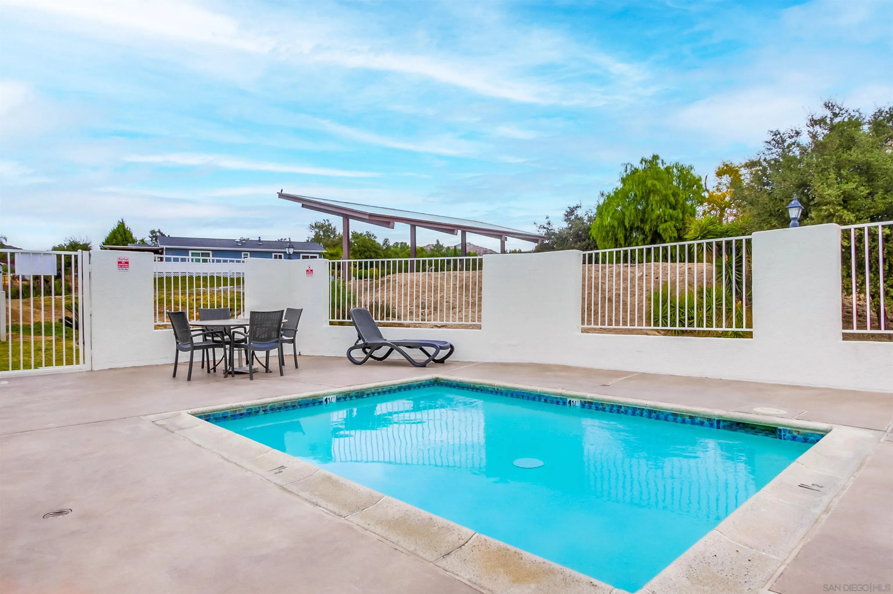 15935 Spring Oaks Road, Unit SPACE 16 El Cajon, CA 92021 - Photo 44 of 45 a view of swimming pool with outdoor seating and plants