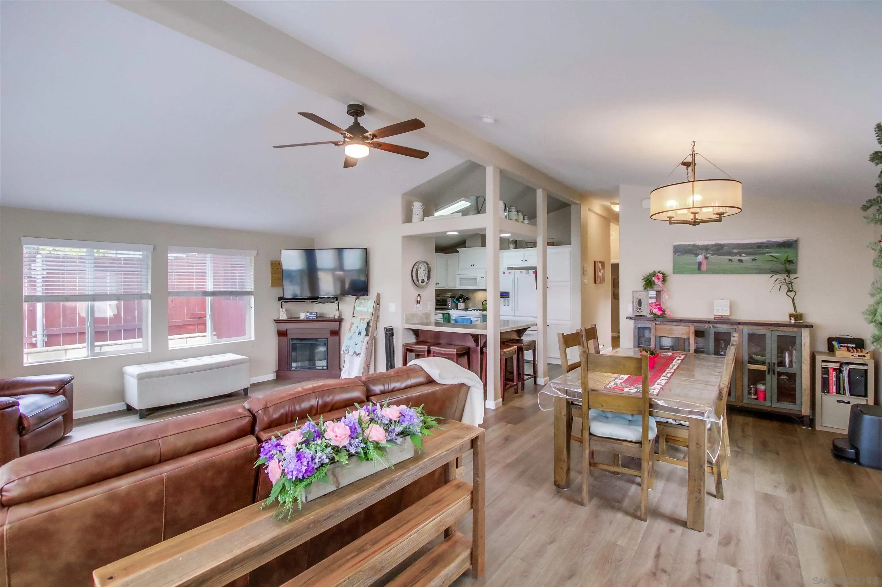 15935 Spring Oaks Road, Unit SPACE 16 El Cajon, CA 92021 - Photo 5 of 45 a living room with fireplace furniture and a wooden floor