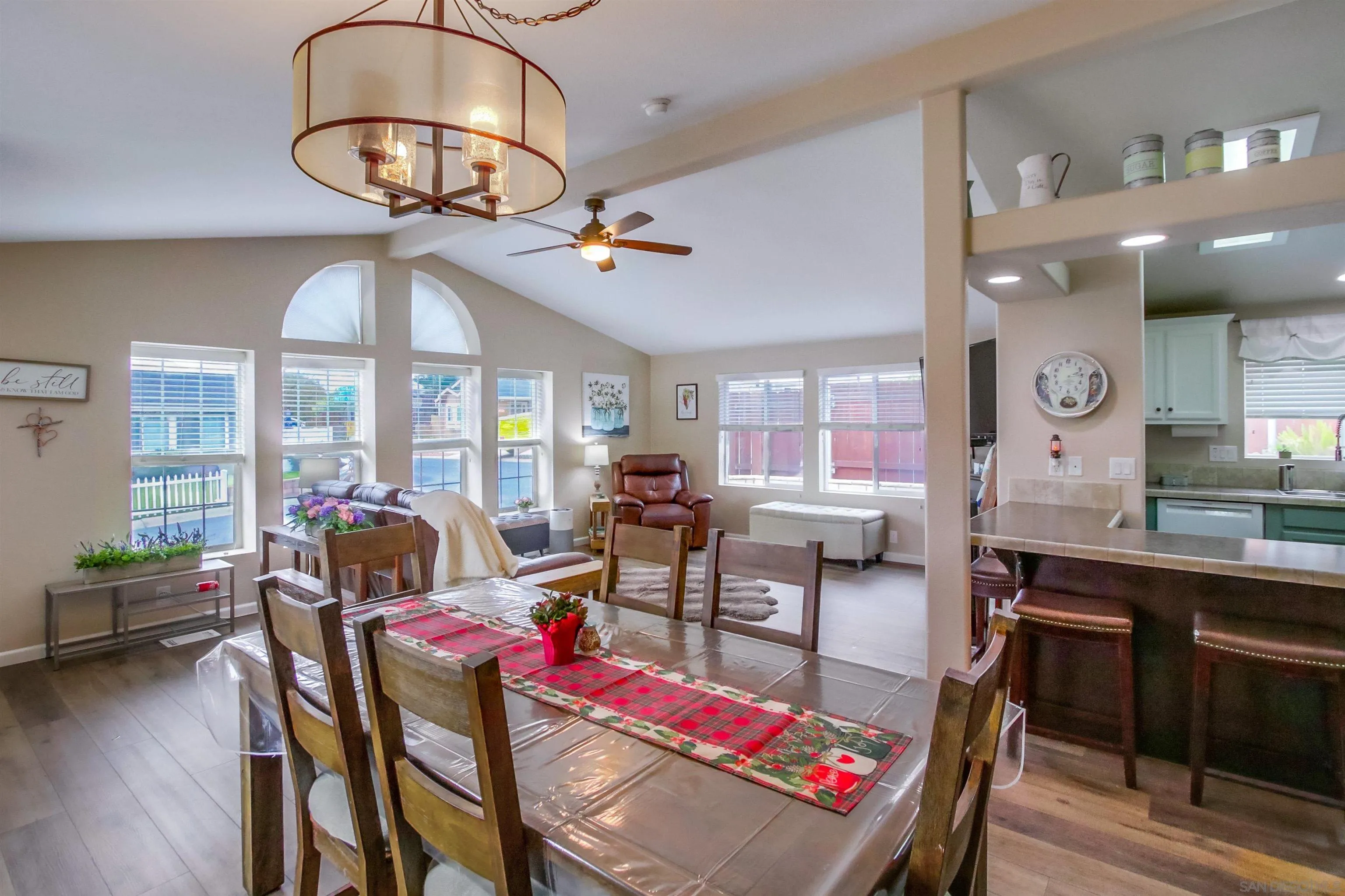 15935 Spring Oaks Road, Unit SPACE 16 El Cajon, CA 92021 - Photo 6 of 45 a living room with lots of furniture and a chandelier