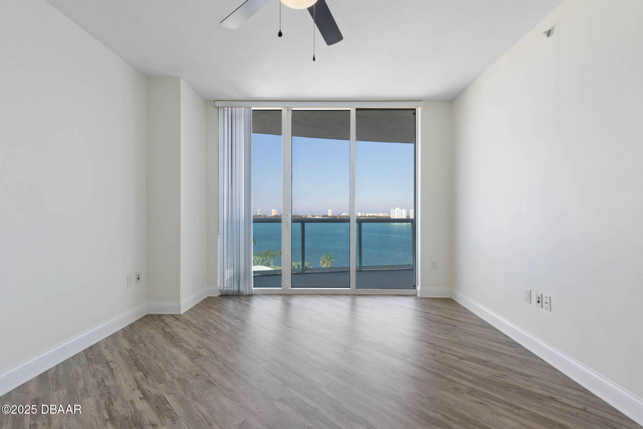 241 Riverside Drive, Unit 708 Holly Hill, FL 32117 - Photo 22 of 80 an empty room with wooden floor and windows