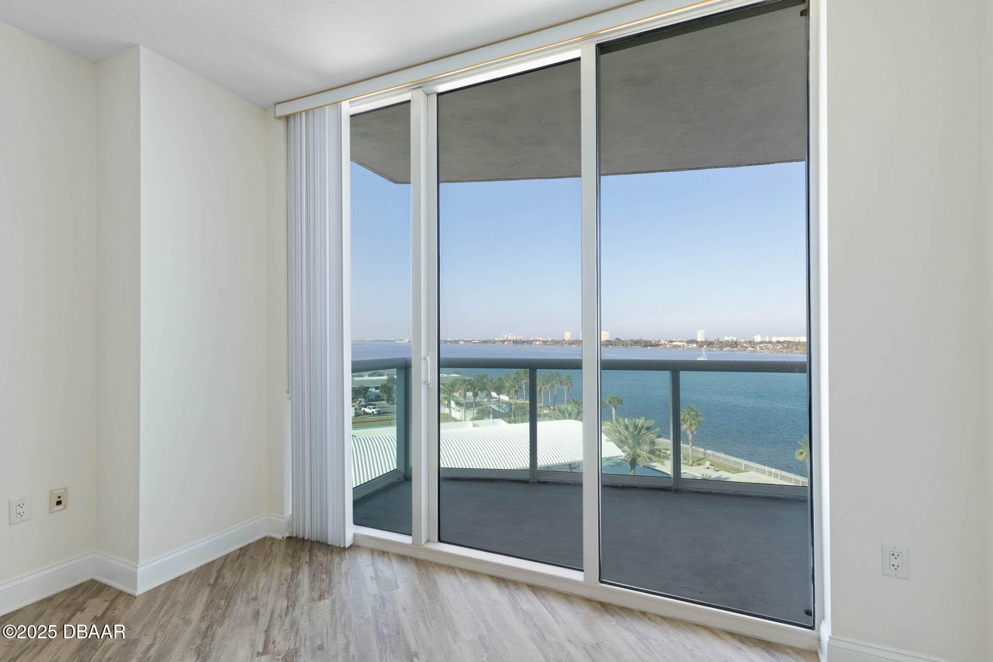 241 Riverside Drive, Unit 708 Holly Hill, FL 32117 - Photo 26 of 80 an empty room with sliding glass door